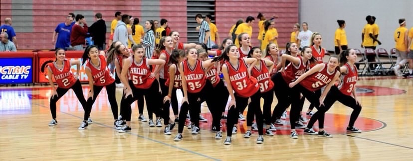 These pictures include both JV  and varsity performing at a basketball game together last year. Photos taken by Steven Lee.