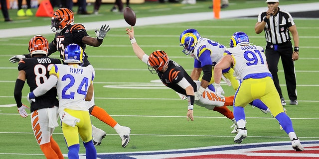 Here Joe Burrow is seen being taken down by a swarm of Rams defensive line on the last play of the Bengals offensive drive.