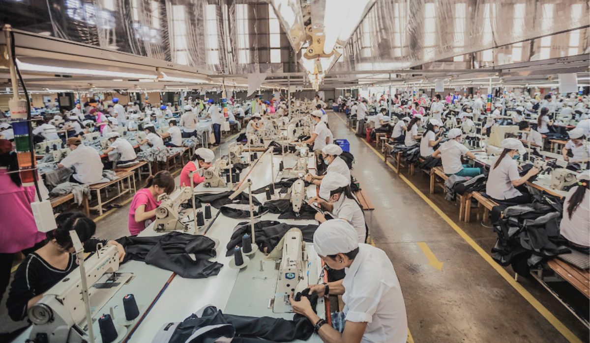 Hundreds of factory workers making clothes for hours for a company that pays them below minimum wage. 