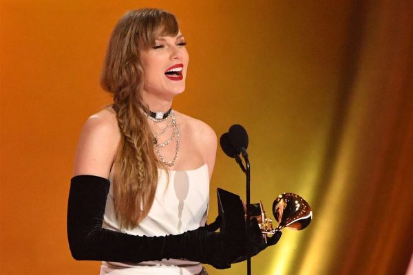 Taylor Swift wins her 14th Grammy Award in 2024.