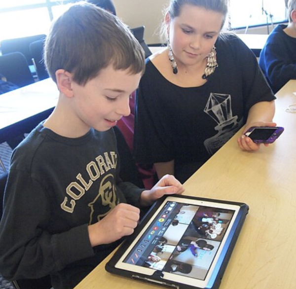 A young boy using an iPad.