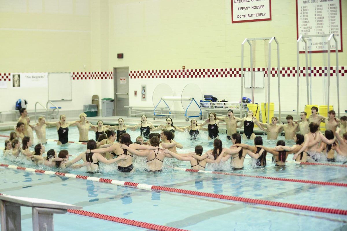 The PHS swim and dive team celebrating after a regular meet.