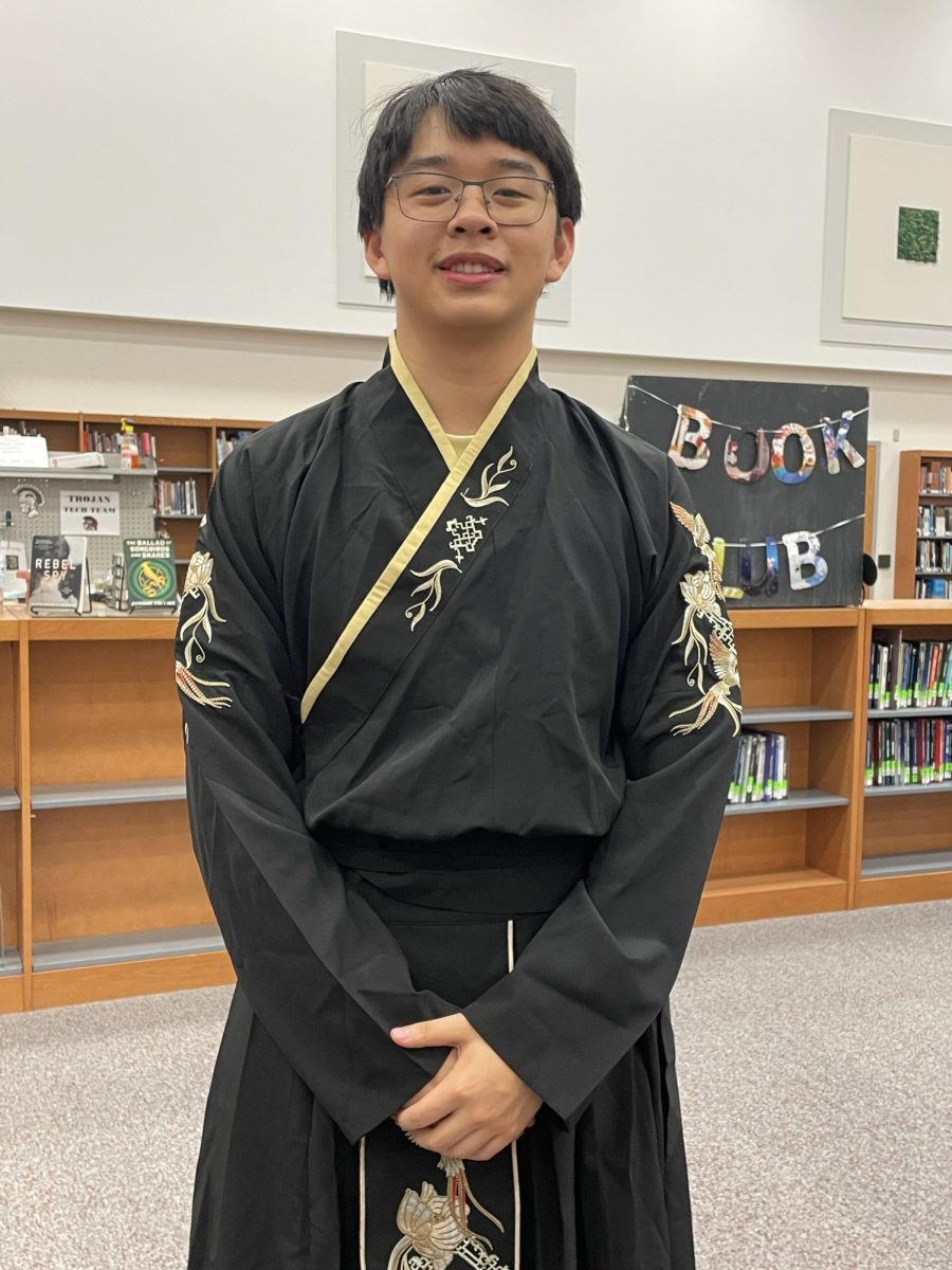 Alexander Zhang (11) wears traditional clothing.