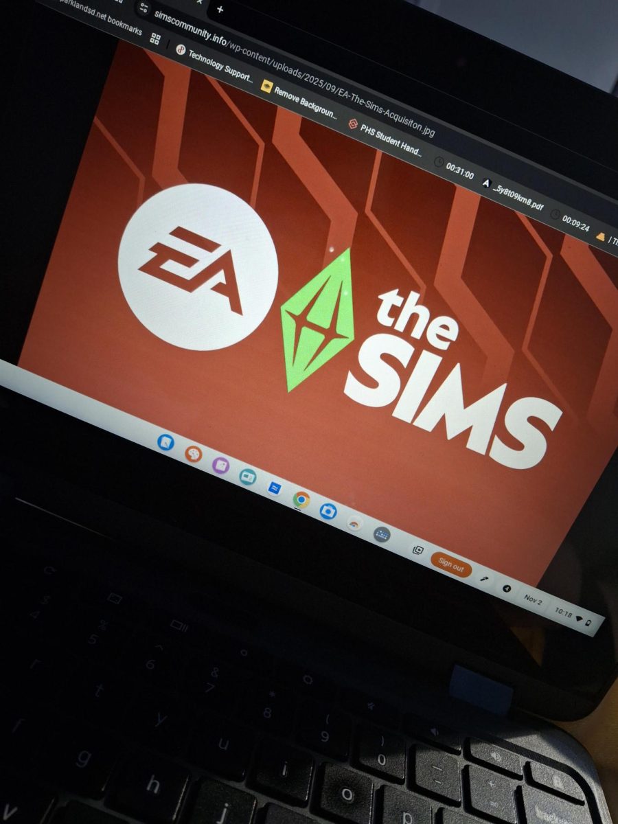 The Sims logo displayed on a laptop screen.