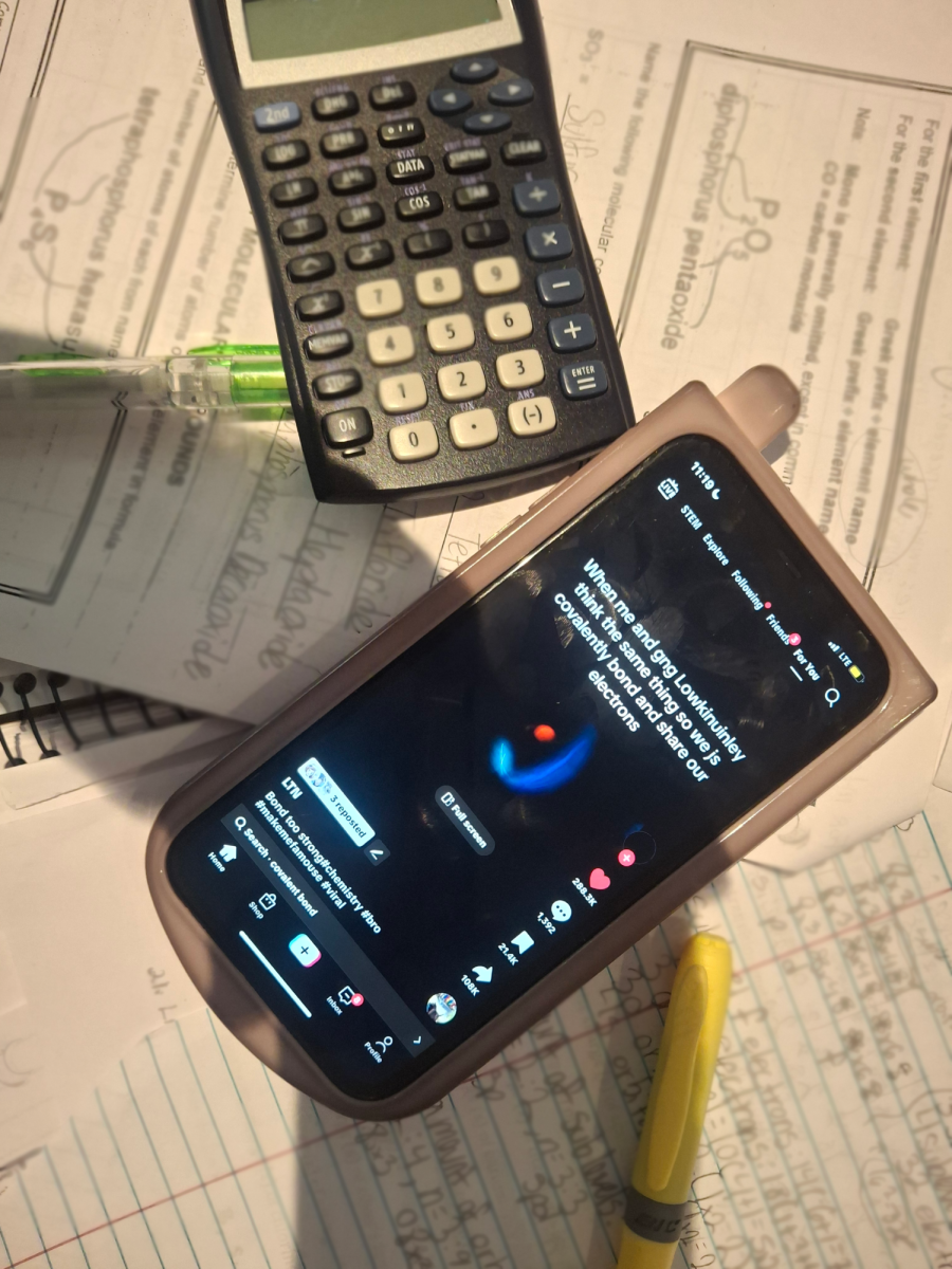 A photo of a phone displaying TikTok while its owner was supposed to be doing math homework.