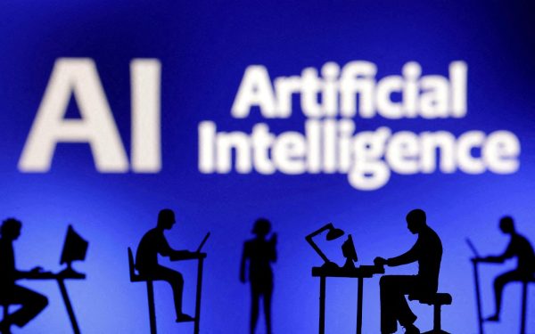 Figurines with computers and smartphones are seen in front of the words "Artificial Intelligence AI" in this illustration created on February 19, 2024. REUTERS/Dado Ruvic/Illustration