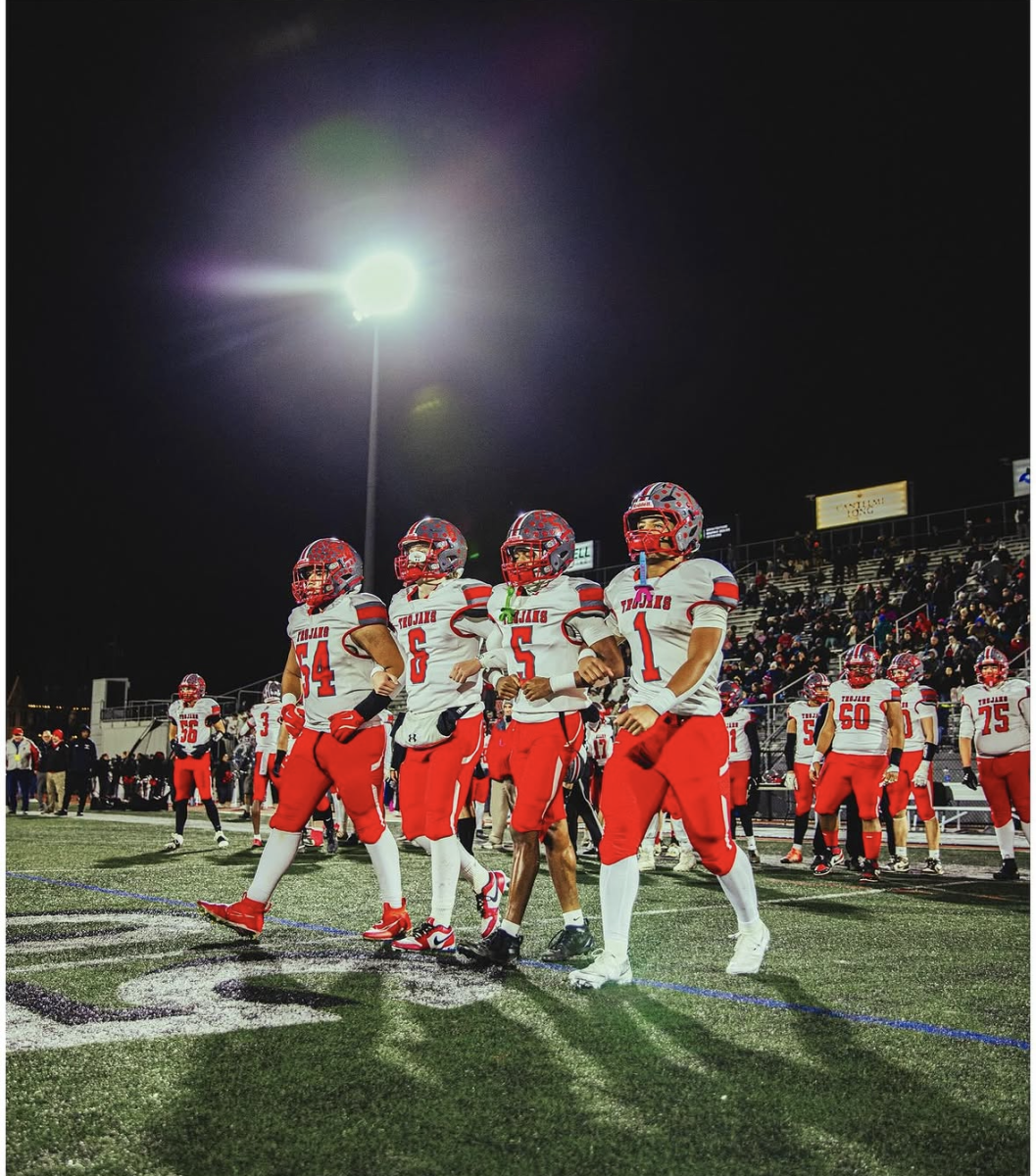 Parkland Football captains walk out to the coin toss in the 2025 District 11 Championship.
